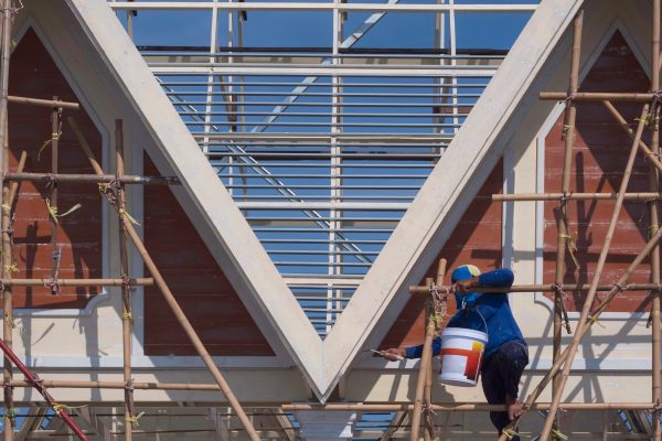 asian-builder-worker-scaffolding-painting-color-gable-roof-structure-construction-site