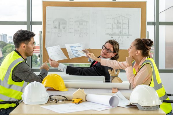 Team of male and female engineers and architects, working team,