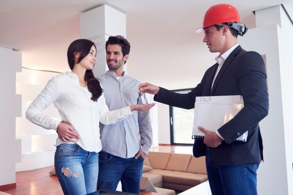 couple buying new home with real estate agent