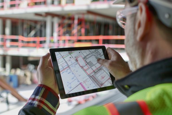 man-is-holding-tablet-with-map-it