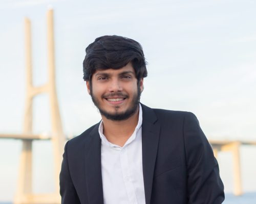 Portrait of good-looking smiling Arabic man in suit